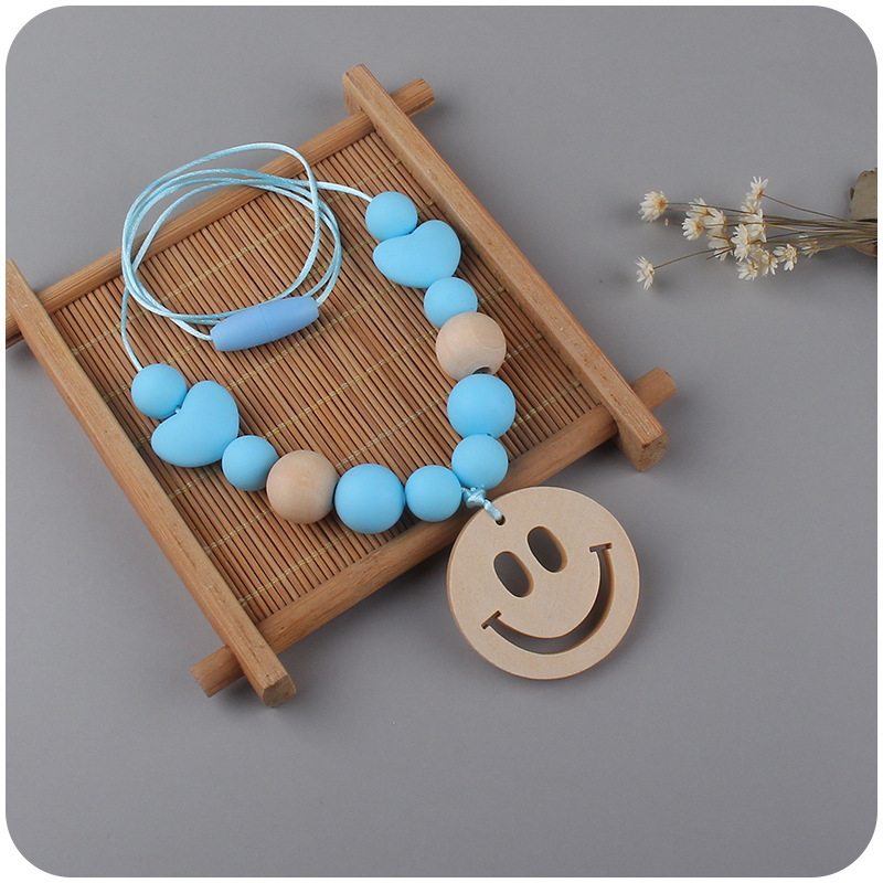 Nuevo bebé suministros smiley cara mordedor collar bebé cuentas de silicona mordida molar masticable colgante collar