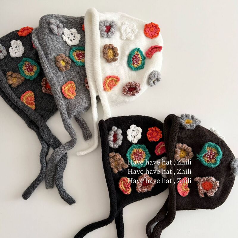 Korean-style retro handmade crocheted floral knitted beanie, a warm and ethnic-inspired hat perfect for autumn and winter, ideal for creating a stylish look in photos Korean-style retro handmade crocheted floral knitted beanie, a warm and ethnic-inspired hat perfect for autumn and winter, ideal for creating a stylish look in photos