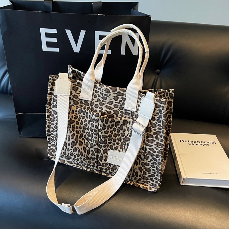 Leopardo tela bolsa de tela para mujeres bolsa de gran capacidad 2024 nuevo estilo relajado sensación de mano viaje bolsa de hombro de mamá