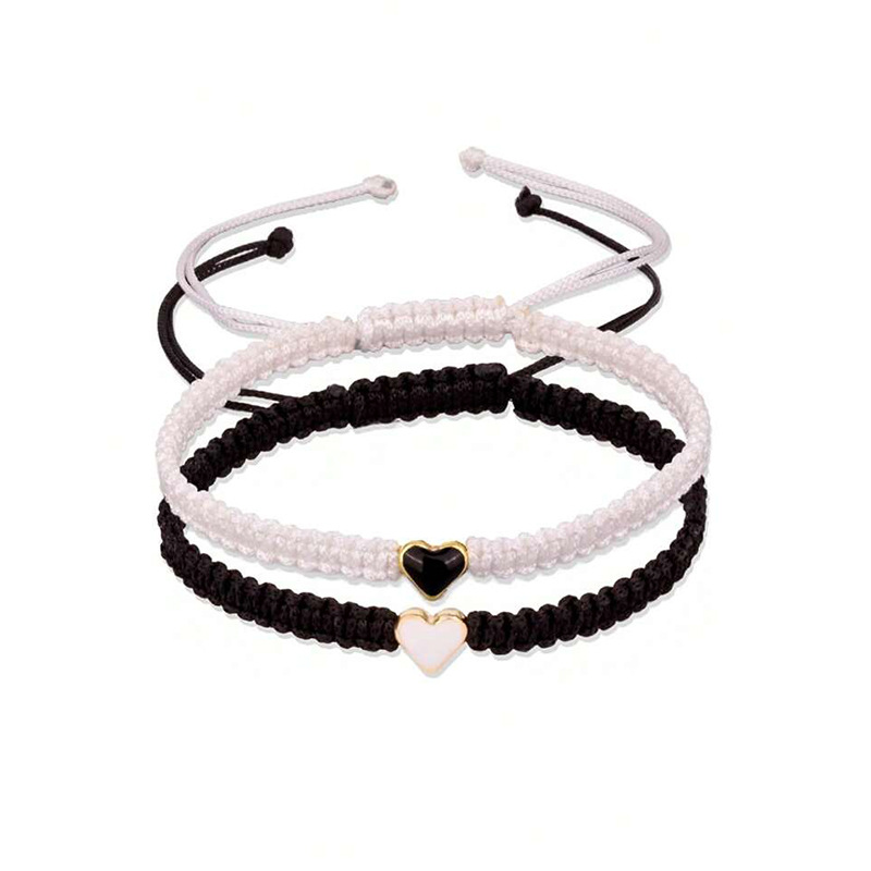 Joyería transfronteriza europea y americana en forma de corazón pulsera tejida a mano pulsera de pareja de amor de las mujeres pulsera de corazón de melocotón blanco y negro al por mayor