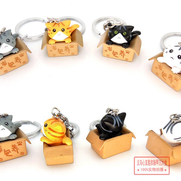 Gato de dibujos animados llavero colgante lindo gato muñeca estudiante adornos campus tienda suministro al por mayor