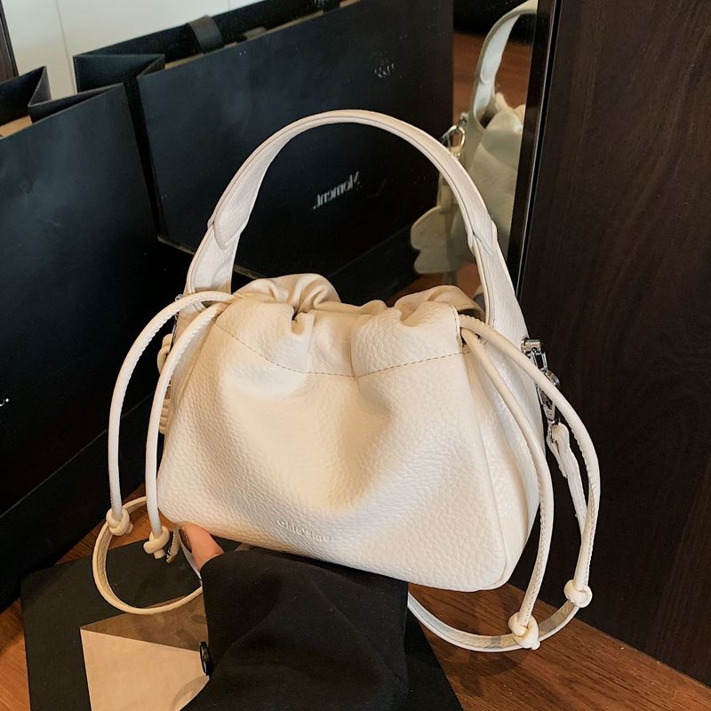 女性のためのハイエンドのソフトレザープリーツハンドバケットバッグ2025新しい韓国スタイルのファッションショルダーバッグシンプルな通勤女性のバッグ|undefined