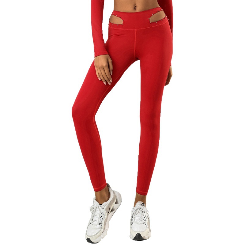 Pantalones de yoga transfronterizos de comercio exterior europeos y americanos pantalones de yoga de mujer huecos elásticos de secado rápido de cintura media-alta Reparación de piernas fitness deportes pantalones cortos