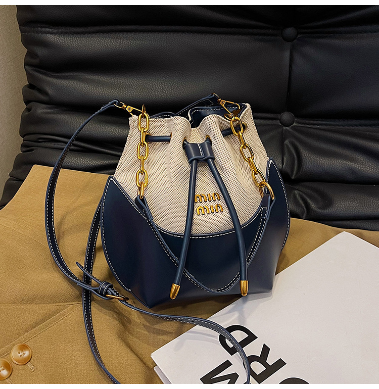 Bolsa de cubo de mano de cadena de alta calidad de mujer nueva moda transfronteriza lienzo de moda empalmado mochila de hombro