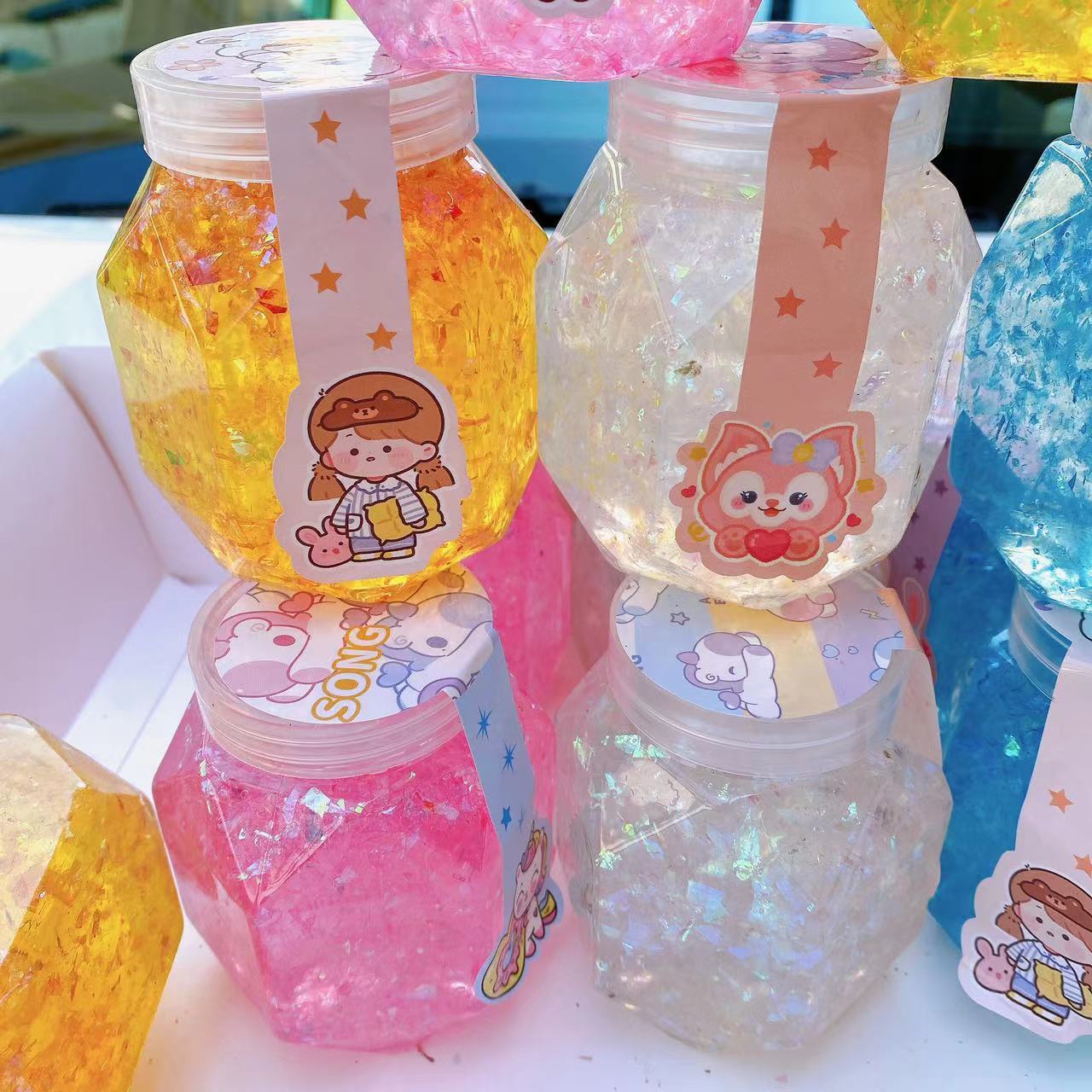 Juguetes para niños barro de color barro de cristal goma espumante alta permeabilidad color brillante barro hexagonal DIY descomprimido 2 yuanes al por mayor