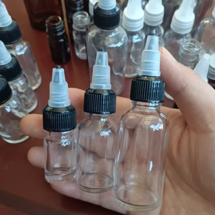 Botella de punta de vidrio Botella de aceite esencial Botella de esencia Botella de agua Botella de solución bruta Botella vacía Botella de goteo de punta rotativa Botella sellada