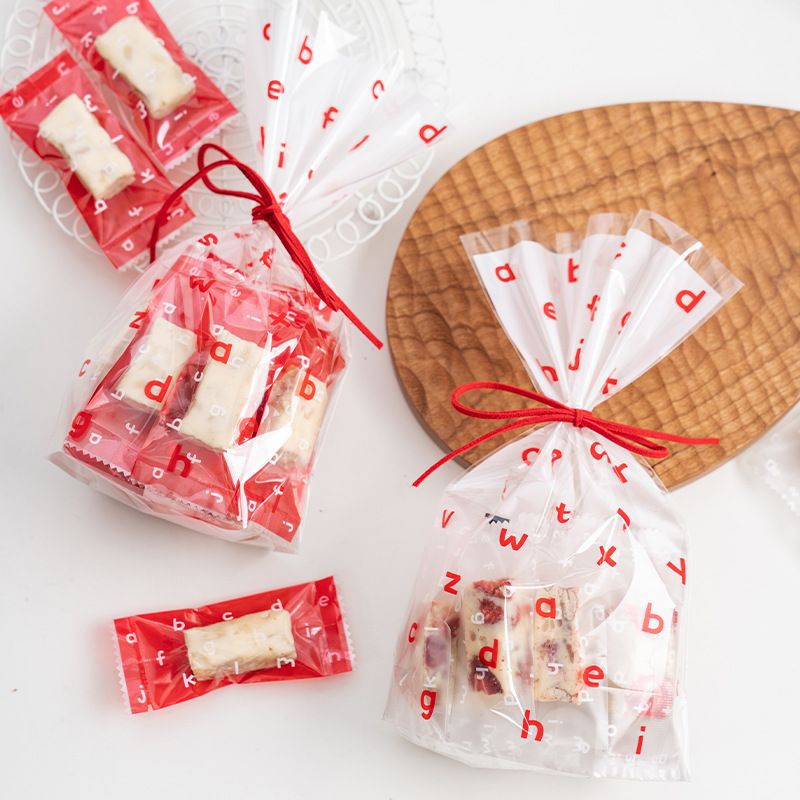 字母红色透明塑料纽扣饼干袋 雪花酥 曲奇牛轧太妃糖自立包装袋子