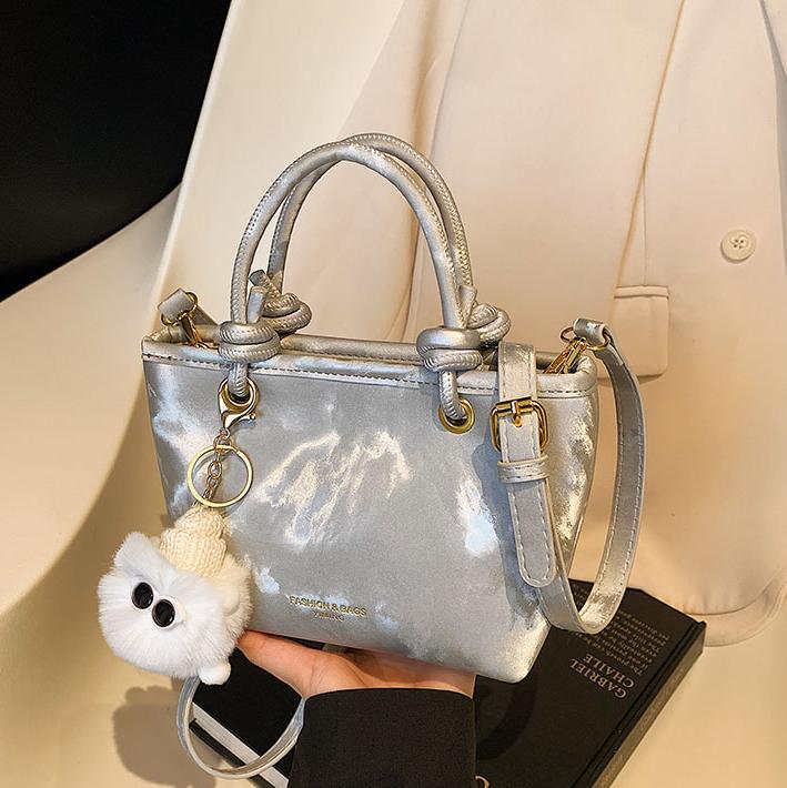 Bolso de mano casual simple coreano para damas 2025 nuevo estilo de transporte universal bolso de cubo popular mochila de hombro