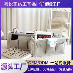 アマゾンのベッドの上の物置は袋の家庭の布芸の収納かごの壁掛け式の寝室の家庭の雑物の収納袋を掛けます。
