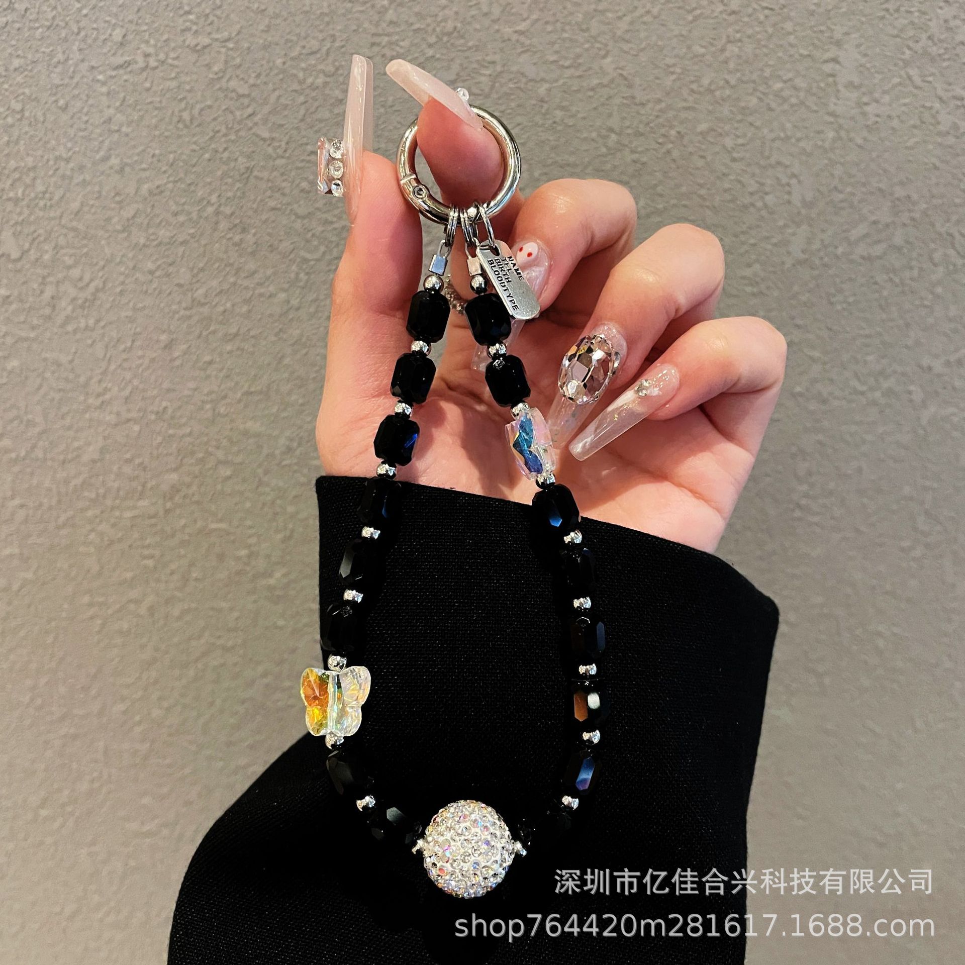 Japón y Corea del Sur estilo transfronterizo nuevo caso de teléfono móvil colgante cadena de cristal string arco de diamante cadena de teléfono móvil colgante de muñeca