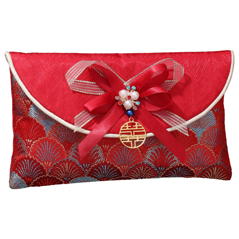 Casarse con el estilo nacional de tela de alta calidad sobre rojo brocado chino, el estilo chino es un regalo de Año Nuevo sellado y una boda de diez mil yuanes.