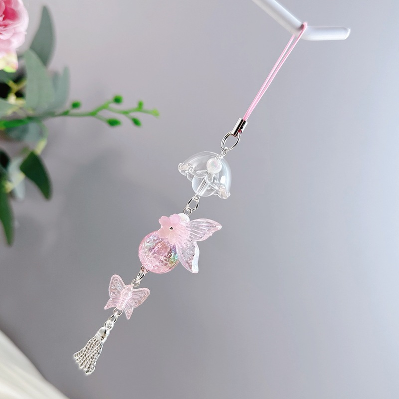 新商品の桜の魚の尾のレーザーはまぶしい色の風鈴の少女を発射します。|undefined
