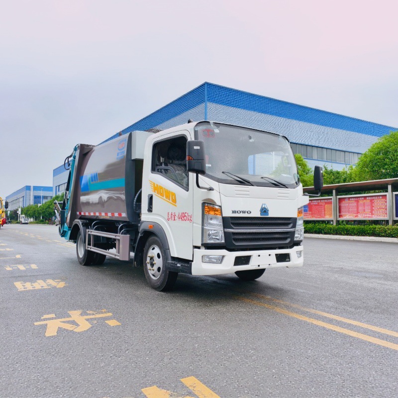 Howo pure electric rear-mounted compressed garbage truck with independent sewage collection for municipal solid waste compaction and removal