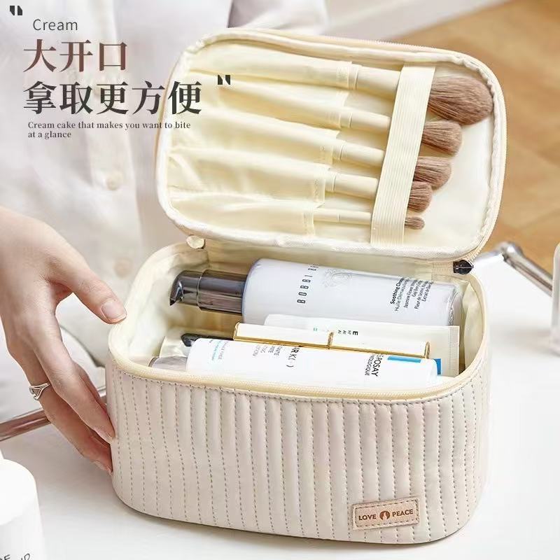 新款防水蛋糕化妆包大容量旅行化妆用品收纳包便携旅游洗漱带哦