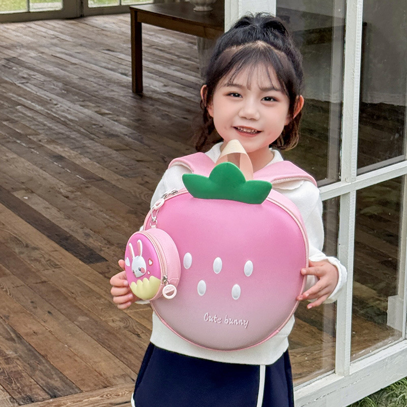 Mochila de dibujos animados para niños y niñas encantadora mochila escolar de estilo de fresa 2025 nueva mochila infantil de cáscara de huevo