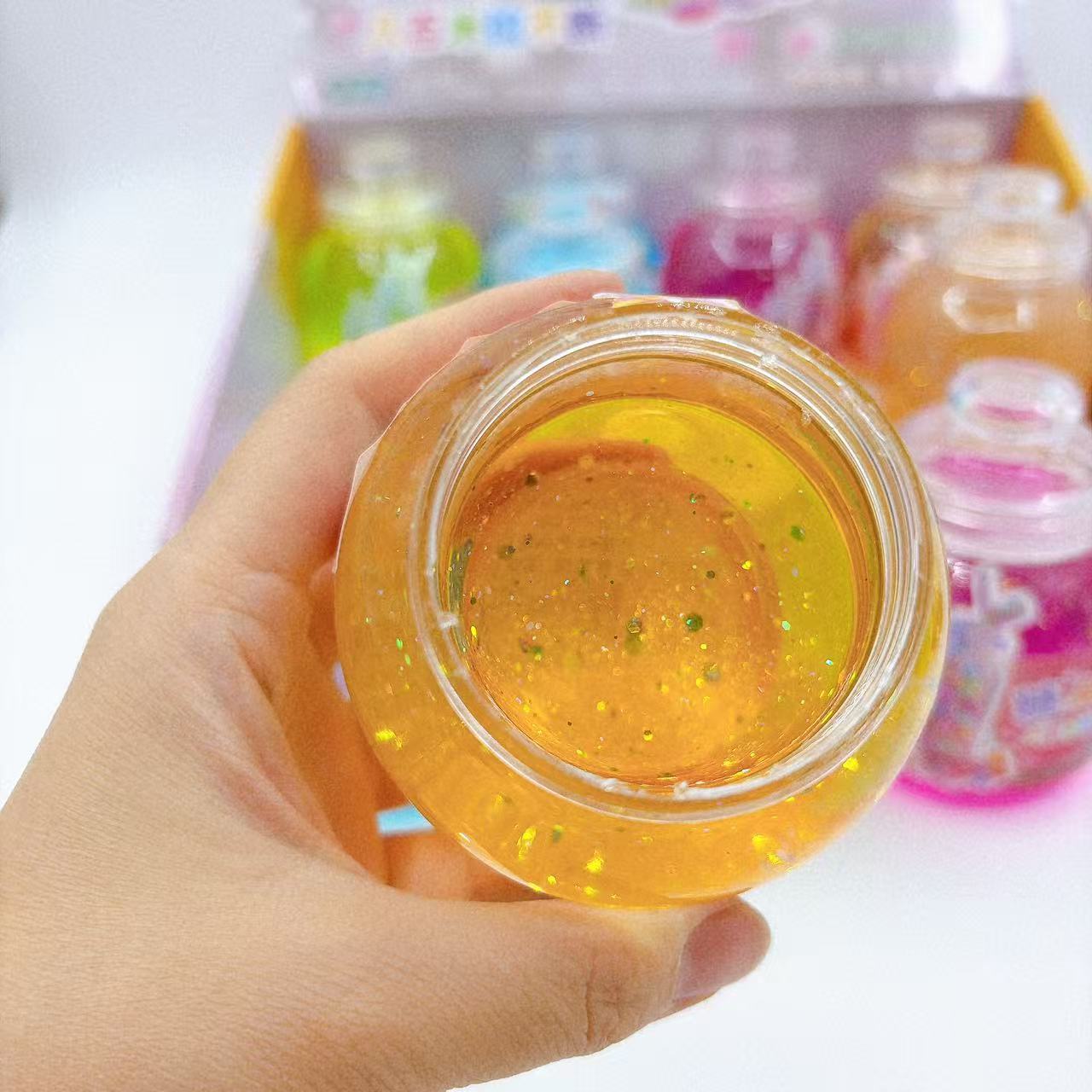 Botella de dulces de barro de cristal colorido botella de barro colorido juguetes para niños goma espumante slime barro transparente al por mayor