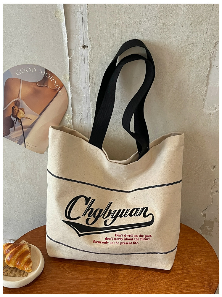 Bolsa de lona de gran capacidad para mujeres 2026 nueva moda letra impresa hombro brazo bolso de viaje ocio bolsa de mano image 7