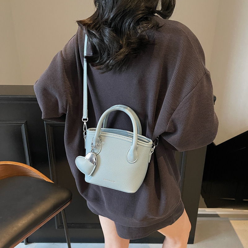 Comercio exterior super fuego mano llevar bolso pequeño mujer 2025 nueva moda todo-fósforo bolso bandolera simple tendencia estilo occidental
