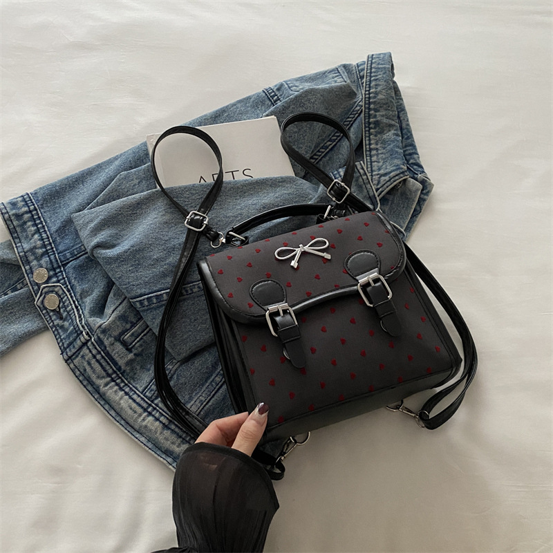 Bolsas casuales populares de este año para mujeres 2024 nueva moda vertical estilo de moda universal doble arco mochila