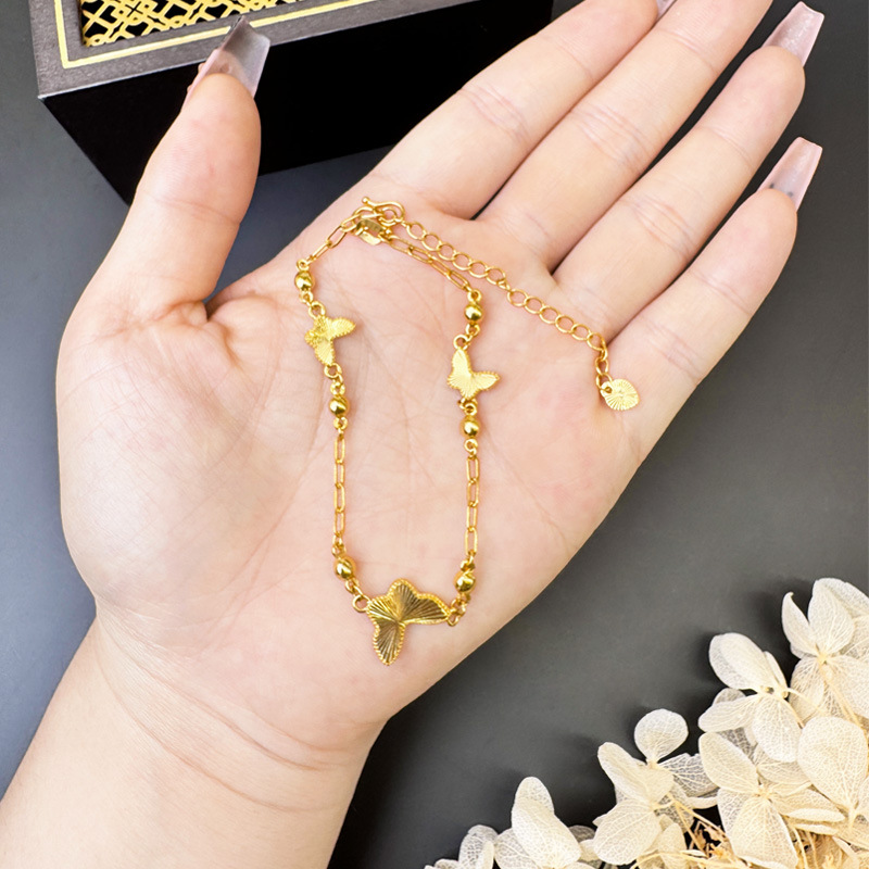 Tobillera de oro de arena de Vietnam, flash, mariposa láser, accesorios femeninos con cuentas, joyería de diseño de nicho de lujo ligero, Yiwu al por mayor