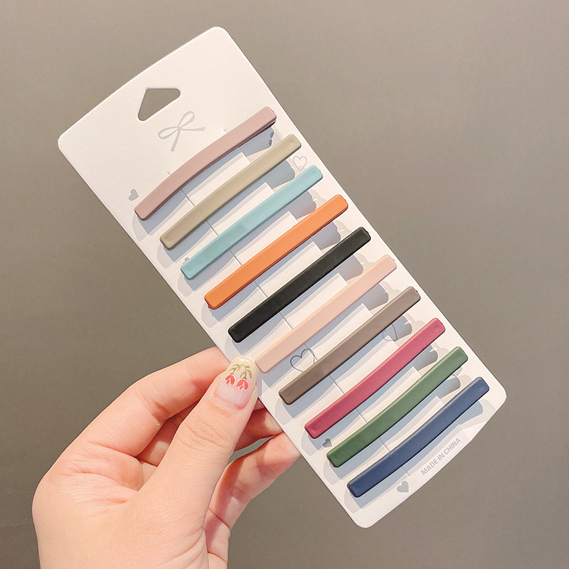 Clip de flequillo lateral rojo de la red femenina 2025 nueva horquilla simple clip de una línea horquilla clip de cabello roto tocado clip de pico de pato