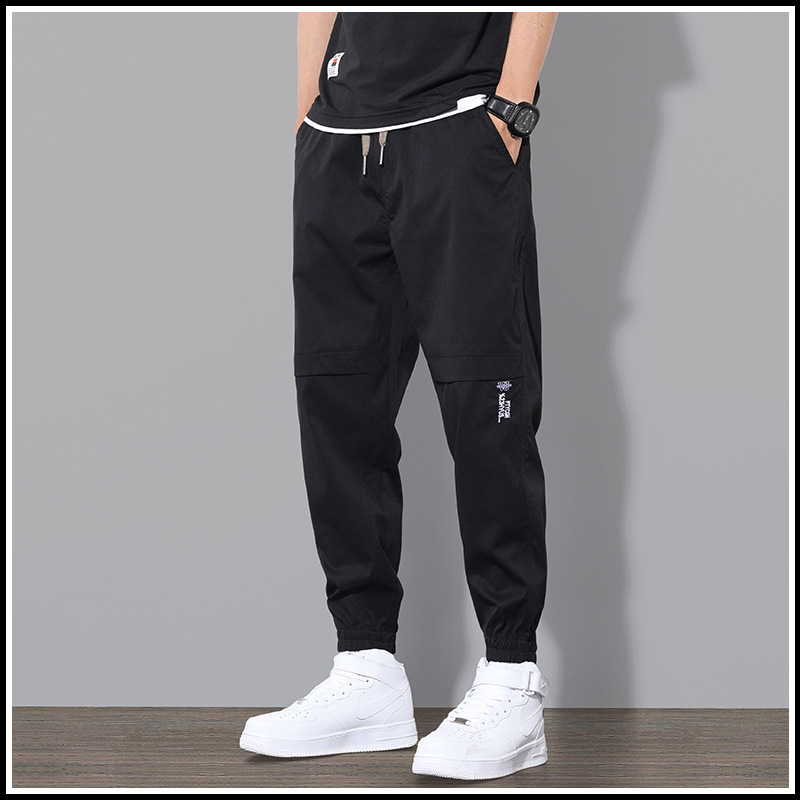 Ropa de trabajo de primavera y otoño pantalones largos pantalones casuales de los hombres pantalones sueltos atados al tobillo marca de moda de primavera y verano Pantalones deportivos delgados