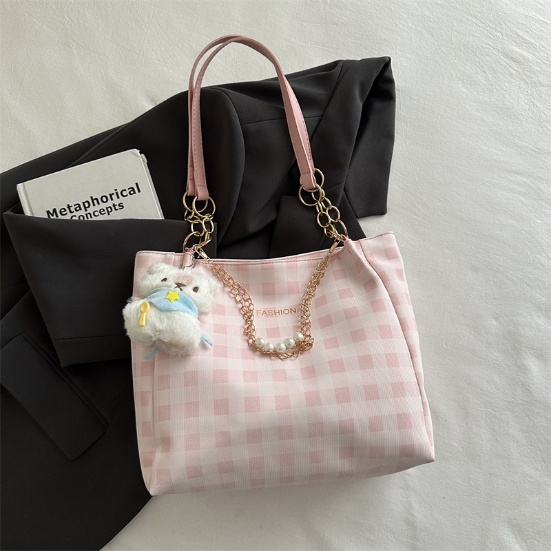 Bolsa de alto valor reticular para mujeres 2026 primavera y verano nuevo paquete de viaje de hombro universal bolso de nicho en línea bolsa de mujer