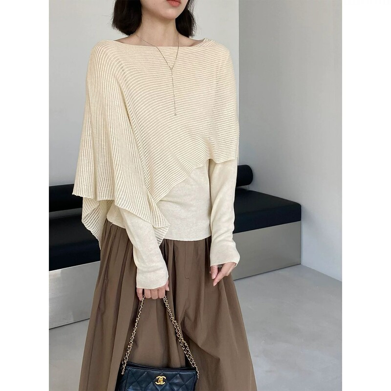 High-end and stylish knitted sweater for women, featuring an asymmetrical cape design, a faux two-piece look, and an Instagram-worthy Korean-inspired design