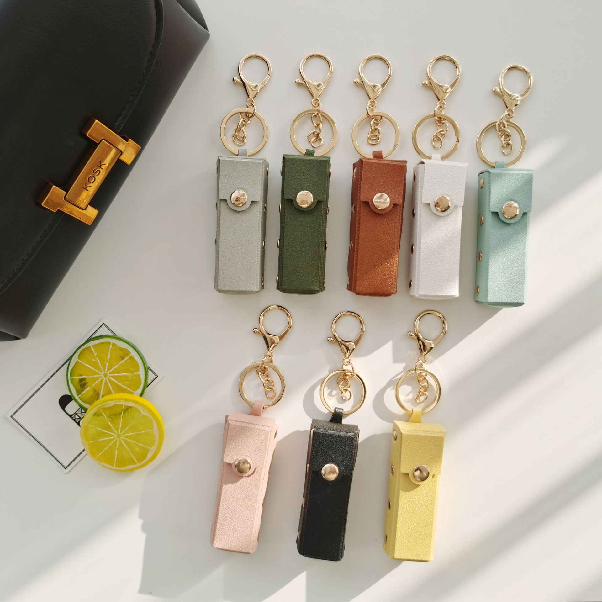 Fábrica directa remache lápiz labial bolsa llavero pequeño regalo PU cuero portátil transfronterizo coche bolsa colgante