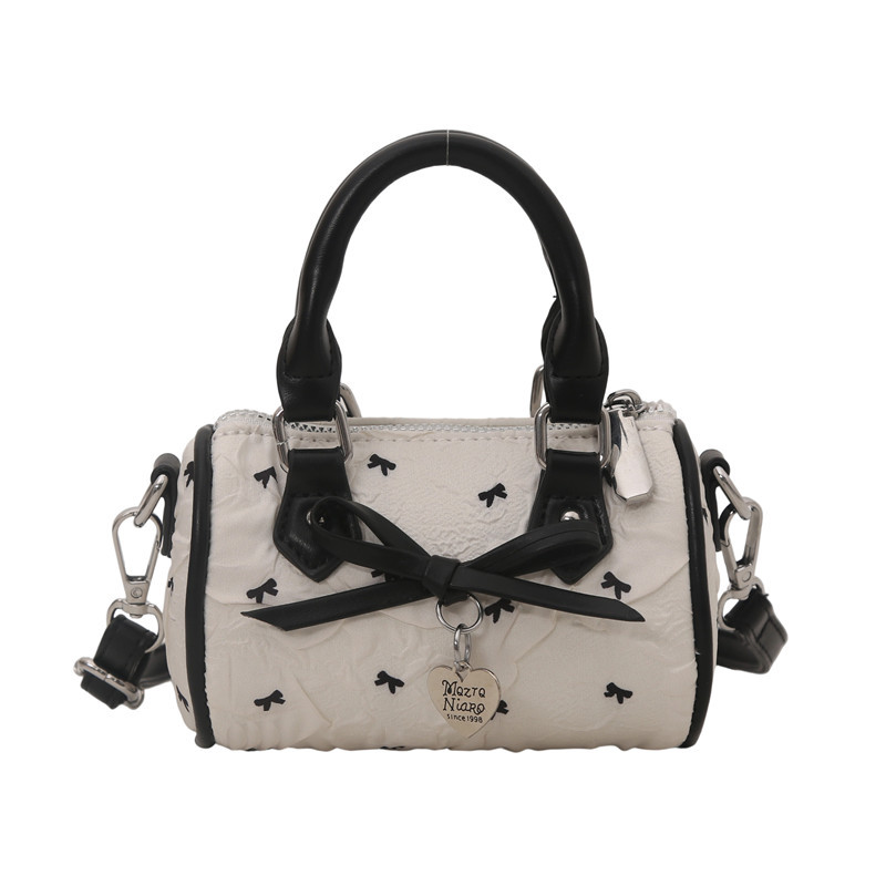 Coreano dulce arco bolso de niña mini lindo bebé bolso de barril de diseño de moda bolso de niños