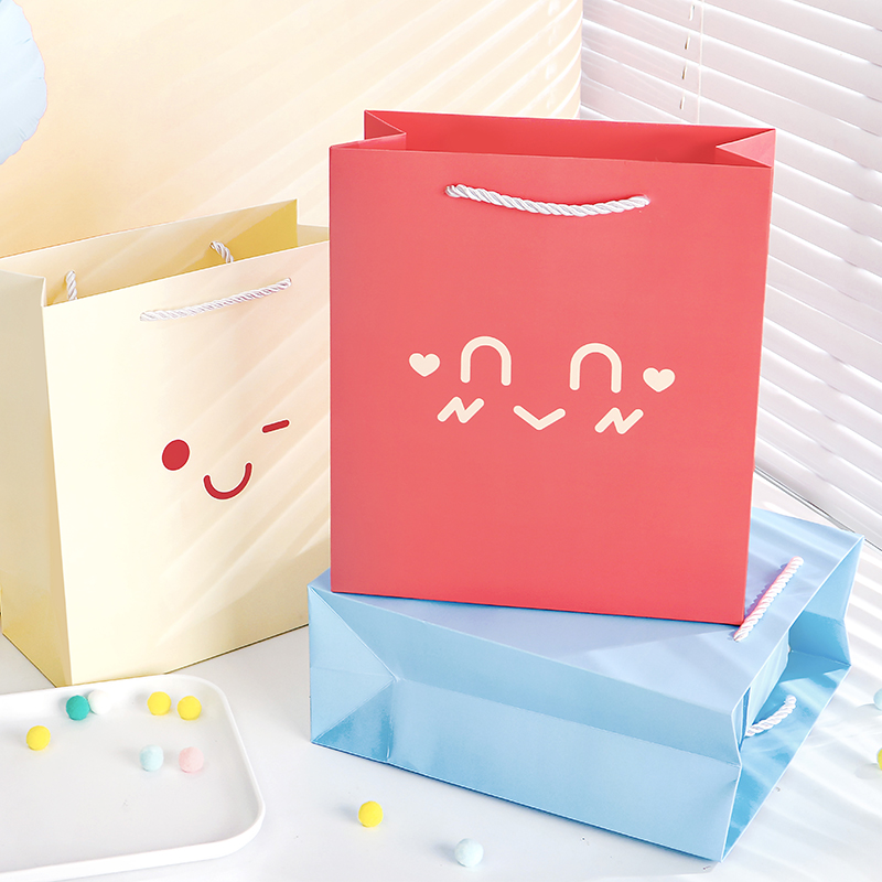 Ins simple señal de emoción bolsa de regalo de alto valor emoji regalo de cumpleaños bolsa de flores