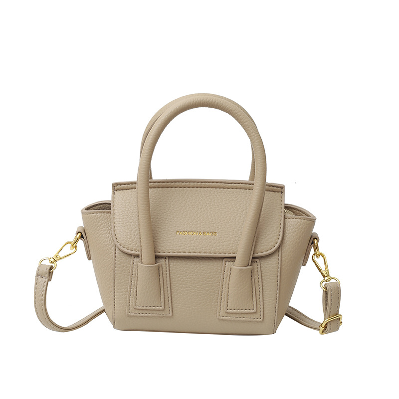 Bolsos populares de este año 2025 primavera nuevo bolso femenino casual patrón de lichi bolso de hombro letra todo fósforo bolso de mensajero