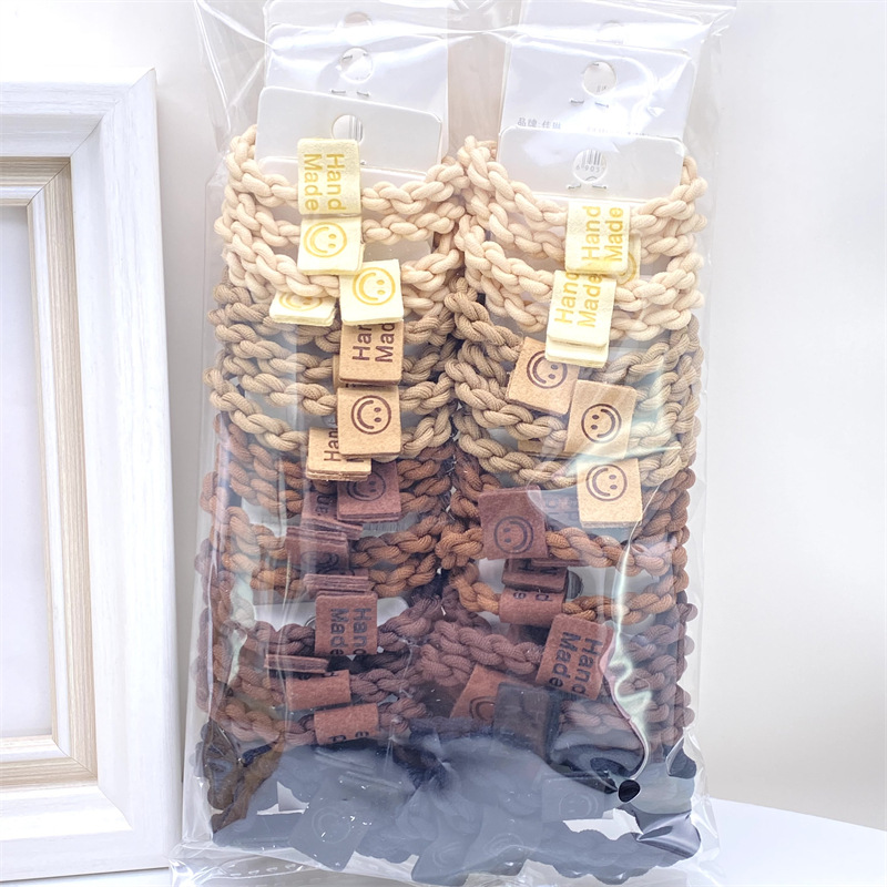 Caqui fresa oso etiqueta de tela anillo de pelo rojo leche té color 03 amor banda de goma lazo de pelo de las mujeres 2 yuanes tienda física