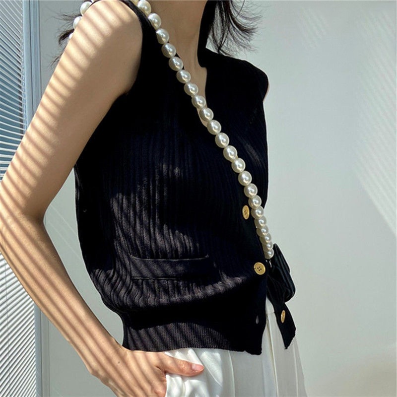 小香風ノースリーブアイスカーディガン女性夏の薄いニットベストの肩の外に洋風のフランスの上着を着ています。