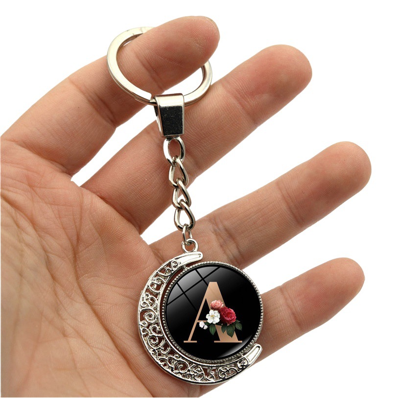 26 letras inglesas llavero 360 grados de doble cara giratoria Luna colgante de metal llavero colgante pequeño regalo