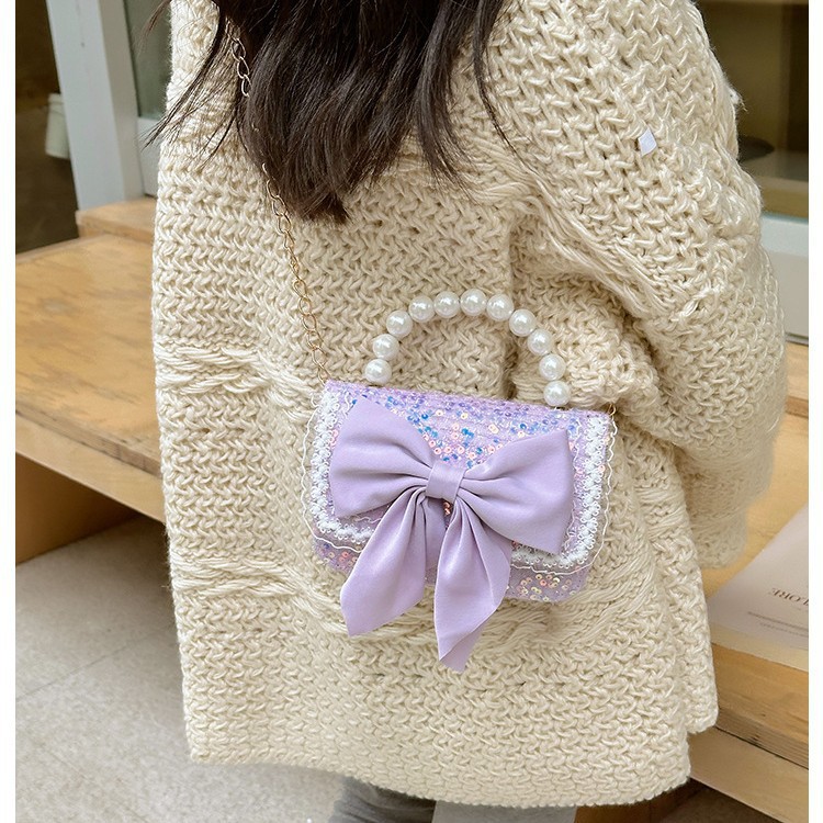 Otoño y invierno coreano arco camellia bolsas de niños de encaje de mano perlas bolsas mochilas para niñas de jardín de infantes