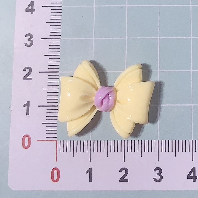 Nuevos accesorios de resina de color macaron de lazo de dibujos animados