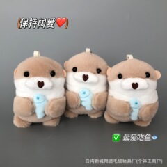 ネットの赤いかわいい小さいラッコのペンダントのぬいぐるみの海洋の動物の公の子のカバンは飾りの人形のキーホルダーの人形を包みます。