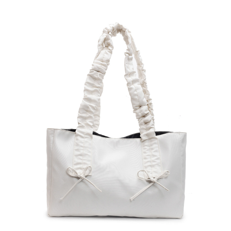 Bolso de arco de la mujer 2025 nueva moda coreana bolso de tela de gran capacidad bolso de mujer de alto valor facial