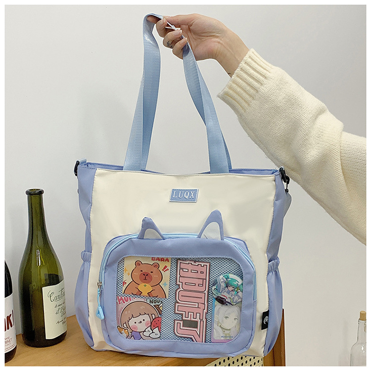 The new cute cartoon printed student bag with a large capacity and transparent student storage single-shoulder bag is selling well for women undefined