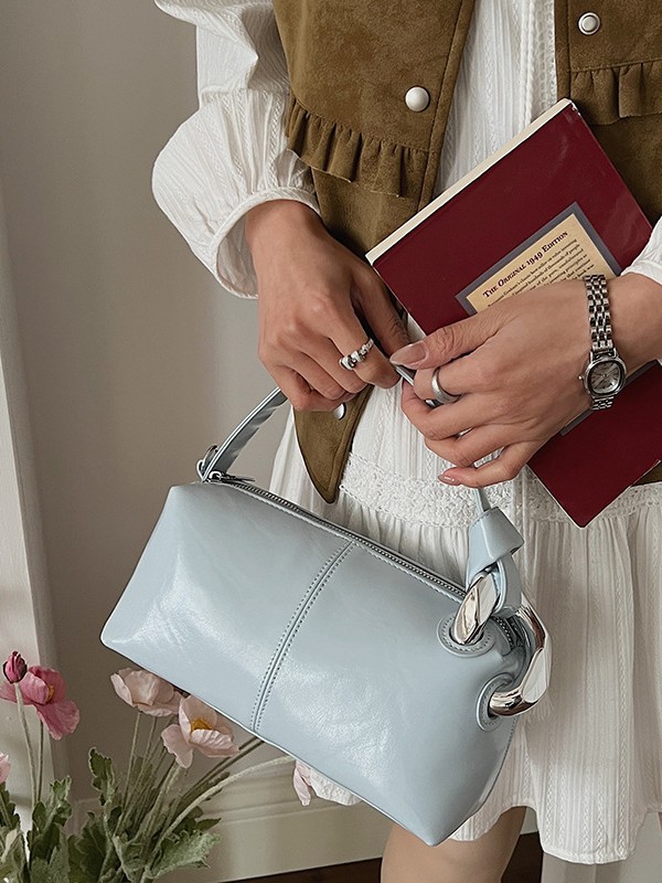 Transfronterizos de alta calidad de tela de cera de aceite bolso de almohada de mano para mujeres 2026 nueva moda lujosa ligera versátil mochila
