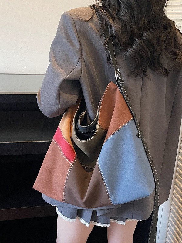 Bolsa de mujer de gran capacidad de hombro bajo la axila venta caliente nueva textura de alta calidad nicho coreano empalme bolso especial