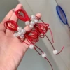 Red earrings with bow pearl