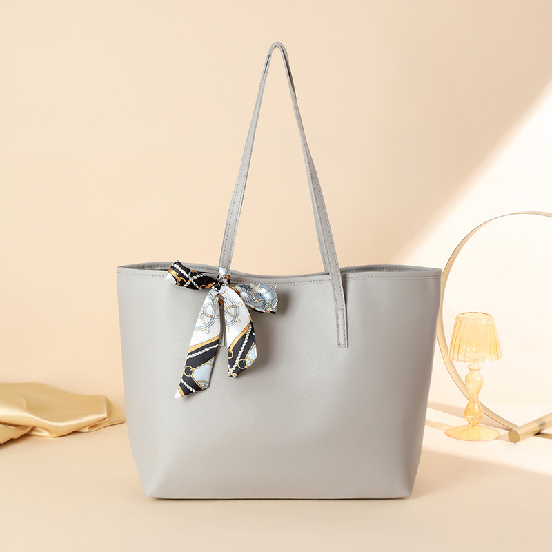 Bolsa de moda de comercio exterior simple y de gran capacidad 2024, nueva pañuelo de seda litchi decorado bolso de hombro de mujer de color sólido