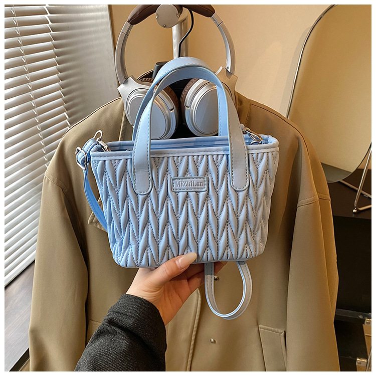 Coreano simple bolso de mano plegable de color sólido bordado de estilo extranjero bolso de hombro para hombres y mujeres nuevos accesorios para niños transfronterizos