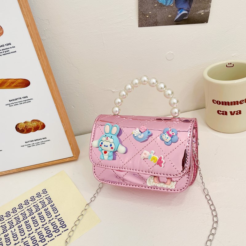 Bolso infantil 2024 nuevo estilo coreano de cadena de dibujos animados bolso de hombro estilo Xiaoxiang Ling mochila para hombres y mujeres bolsos pequeños