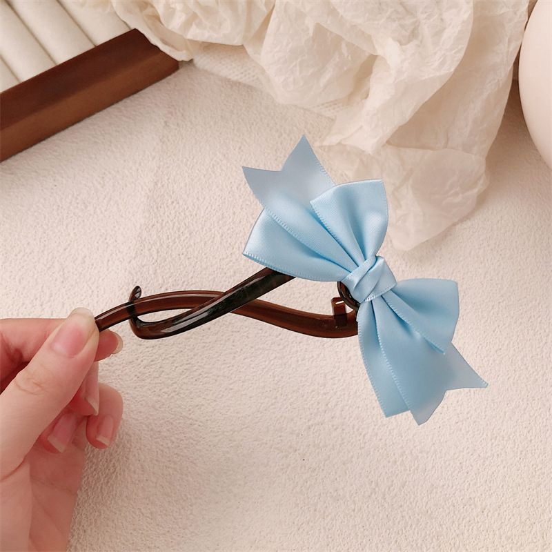 Tela retro arco banana clip para el cabello mujeres 2024 nuevo clip de agarre de alta calidad cabeza de torsión clip clip para el cabello