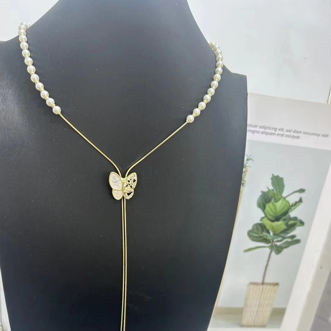 Collier de perles à tirer pour femme, chaîne ras du cou à pompon papillon haut de gamme et polyvalente, chaîne tendance unique pour pull_voghion.com