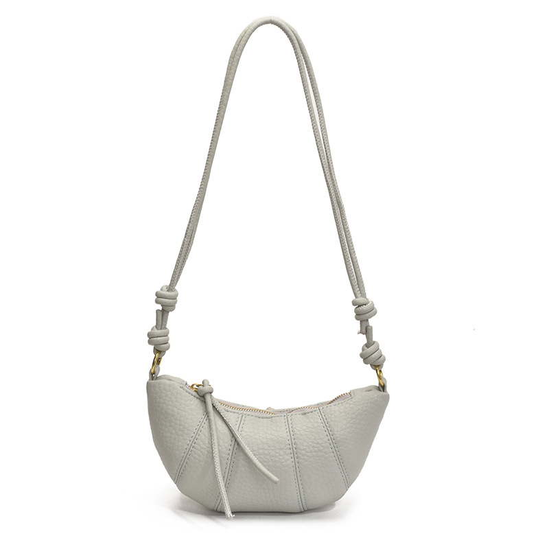 Bolso de cuerno de nicho francés 2025 nuevo bolso de axila bolso de bola de masa de moda bolso de mensajero de hombro simple de todo fósforo