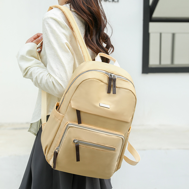 Nueva mochila casual para mujer, mochila escolar de nailon de gran capacidad para estudiantes, mochila de viaje ligera de todo fósforo al aire libre al por mayor